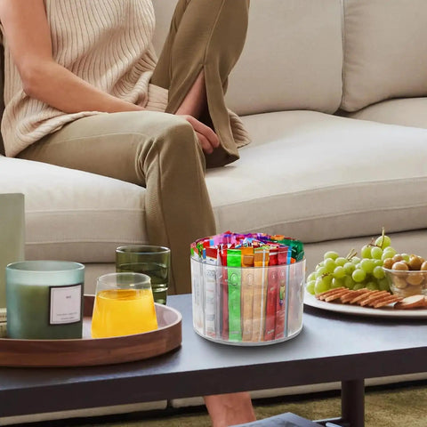 360 Degree Rotating Drink Packet Organizer Lazy Susan For Powdered Drink Mixes And Condiments on a coffee table, clear design