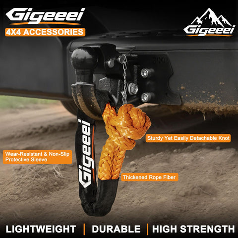 Beefy Half Inch By 22 Inch Soft Shackle Recovery Kit for off-road winch, showing orange UHMWPE fiber with durable sleeve on vehicle hitch.
