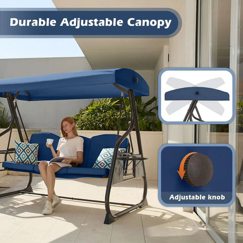 Woman relaxing on Three Seat Patio Porch Swing With Canopy And Adjustable Backrest, Outdoor Glider With Stand, Foldable Side Tray And Removable Pillows, Heavy Duty 800 Lb Capacity, Perfect For Balcony Garden Deck; blue canopy and pillows