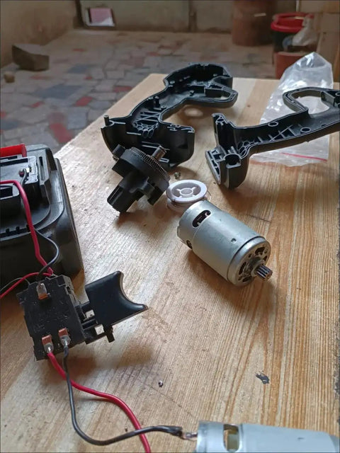 Beast 18V DC RS550 Style Motor with 12-Tooth Gear, 20500 RPM high-speed electric motor on wooden table with components