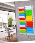 Heavy Duty 28 Slot Guest Room Key And Badge Organizer Rack featuring sleek smart storage in an office with colorful compartments.