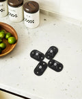 4pcs Small Furniture Adhesive Swivel Caster Wheels on a countertop, black, easy-install adhesive design for crafts or furniture.