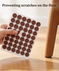 Top Shelf Self Sticky Felt Pads 48 Pack Brown Round Bumpers for Chair Legs and Cabinet Doors, showing adhesive pads on a sheet.