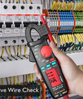Hand using DC Current Clamp Meter 6000 Counts Digital Multimeter Amp Continuity Ohm Hz Live Check V Alert Voltage Tester