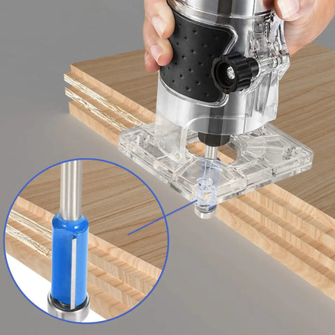 Close-up of a Four Piece One Quarter Inch Shank Top Bearing Flush Trim Router Bit Set with 1/4 inch bit in use on wood veneer.