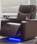 Power Reclining Chair With USB Ports, Cupholders, LED Light in dark brown faux leather in home setting