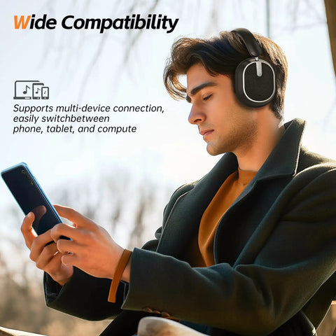 Person using phone outdoors with Hybrid ANC Wireless Headphones With All Day Comfort And Deep Bass, Hi Res Audio, Memory Foam Cushioned Ear Pads