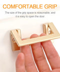 Gold Hidden Exposed Door Pull Handles Set installed on cabinet, demonstrating comfortable grip, 32mm spacing, sleek modern design