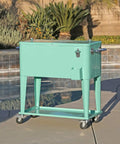 80 Qt Retro Rolling Cooler Ice Chest Cart With Shelf And Bottle Opener Seafoam by poolside, perfect for backyard BBQs