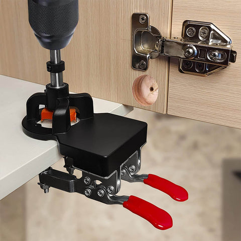 Concealed Positioning Hinge Hole Punch 35mm Door Hinge Jig With 2 Retaining Clips in use, mounted on wooden cabinet door for drilling.