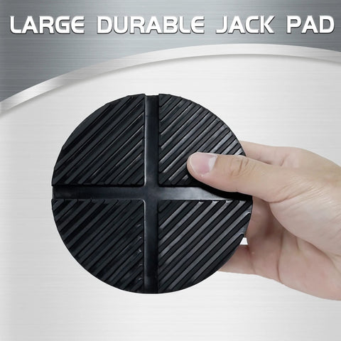 TONDA floor jack rubber pad, round black rubber disk with diagonal grooves, held in hand.