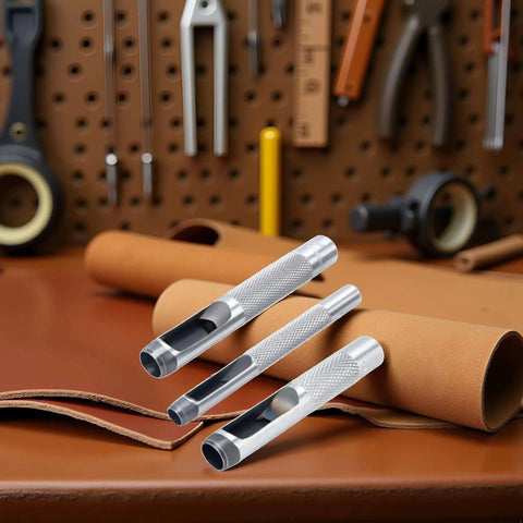 Three-Piece Grommet Hole Punch Set For Leatherworking on leather surface with tools in background