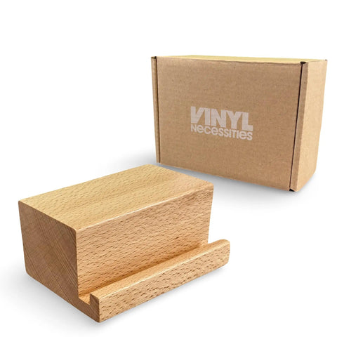 Legit Solid Hardwood Turntable Stand For LP Records And Album Jackets To Show Off Your Fresh Vinyl Collection While Spinning Tracks Without Messing Up Your Smooth Lounge Or Desk Area Setup. Solid wood display rack with a sleek design.
