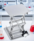 Stainless steel lab jack scissor stand with 4x4 in lifting platform; manual control with black hand wheel, adjustable 50–150 mm
