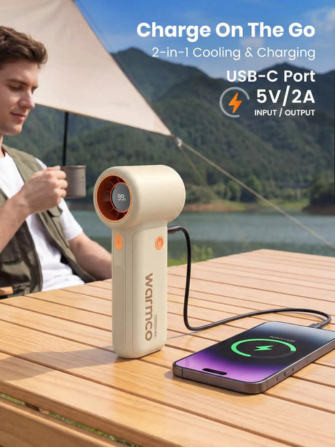10000mAh Portable Handheld Fan With USB Rechargeable Power Dope Mini Turbo Breeze on table charging phone, outdoor scene
