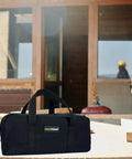 Workhorse Waxed Canvas Tool Tote Bag Set With Two Medium Tool Organizer Bags, 14 Inch Black, on construction site table.