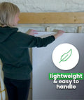 Person handling Double Bubble Reflective Foil Insulation Roll 48 X 75 Feet, lightweight material for easy installation.