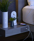 Radiant Furniture Power Center with USB and Recessed Power Strip 2 Outlets on nightstand beside bed, phone charging