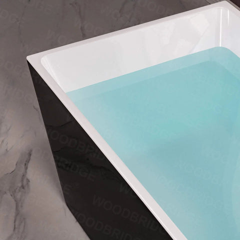 Close-up of Contemporary 67 Inch Freestanding Acrylic Soaking Bathtub With Matte Black Drain and Overflow with water.