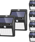 Six Pack Solar Outdoor Lights With Three Modes Dim Long Light Mode Bright Sensor Mode And Motion Detection For Security Waterproof Outdoor Lighting For Garden Fence Patio And Garage, shown in a set of six.