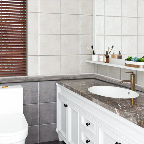 Bathroom with gray Peel And Stick Self Adhesive Vinyl Strip for transitions, visible against tiled wall and countertop edge.