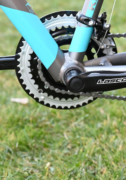 Close-up view of MTB Crankset For Mountain Bikes 170mm Square Taper 9 16 Inch Chainring Set Front Sprocket 18 21 24 Speed Compatible Tough Steel Arm With Wide Tooth Narrow Design To Maximize Chain Contact installed on a mountain bike.