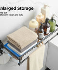 Space Saving 24 Inch Wall Mounted Towel Rack With Foldable Shelf And 7 Hooks in use, storing towels and bottles in bathroom.