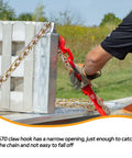 Man securing Beefy Heavy Duty One Quarter Inch Tow Chain Twelve Foot With G80 Grade Log Chain on flatbed with red lever.