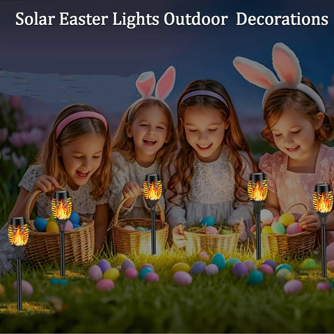 Children playing with baskets and decorative eggs, surrounded by Solar Flickering Flame Outdoor Torch Lights For Garden Decor