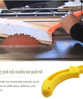 Two Pack Table Saw Push Sticks For Safe Woodworking in use on table saw, guiding wood piece for safety and control, preventing kickback.
