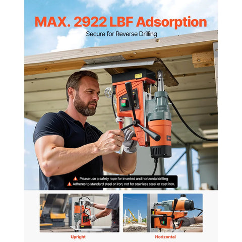 VEVOR magnetic drill press, orange and black, front view being operated by a man on a metal surface
