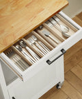 Slick Rolling Microwave Cart With Boss Level Storage Built Onto A Rock Solid Rubberwood Base, Crisp White kitchen cart drawer with silverware.