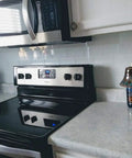 Easy DIY Peel and Stick Glass Backsplash Tiles for Kitchen or Bathroom, Subway White 3x6 Inch Glass Tiles behind a stove