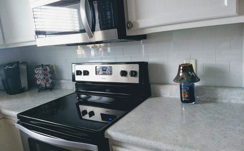 Easy DIY Peel and Stick Glass Backsplash Tiles for Kitchen or Bathroom, Subway White 3x6 Inch Glass Tiles behind a stove