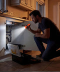 Person using Flat USB C Rechargeable LED Flashlight With 6 Modes Ultra Bright Handheld Light for home repair under sink.