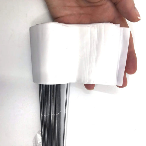 White Marking Flags With 15 Inch Wire Staffs, 2.5-Inch By 3.5-Inch High Visibility Flags shown in hand