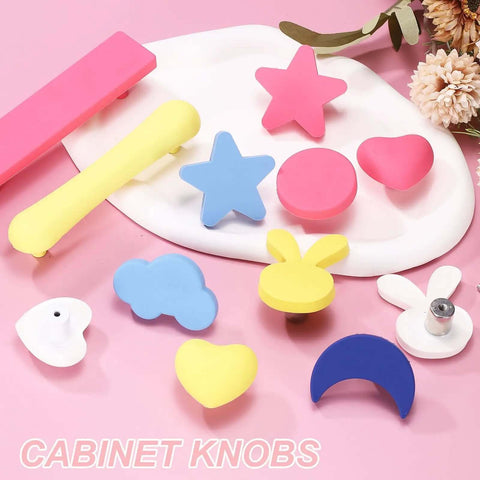 Heart Shaped Cabinet Knobs And Dresser Pulls Set Featuring A Slick Yellow Finish For Fast Cupboard Swaps That Will Make Your Kitchen Layout Look Absolutely Dope. Set of colorful rubber knobs on a pink background.