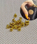 Gold Flat Head Turn Lock Screws 40 Pack Small Phillips Replacement Hardware Kit With Tool For Purses Handbags Wallet Totes Quilted Bags No Sweat Repair Set, group of screws on fabric.