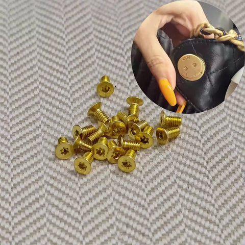 Gold Flat Head Turn Lock Screws 40 Pack Small Phillips Replacement Hardware Kit With Tool For Purses Handbags Wallet Totes Quilted Bags No Sweat Repair Set, group of screws on fabric.