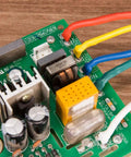 Close-up of electronics circuit board with Two To One Heat Shrink Tubing Set With Flame Retardant V0 Rating in multiple colors on wires.