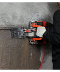 Badass 5200W Electric Wall Chaser cutting through concrete with laser tracking and adjustable depth settings.