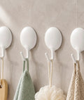 Heavy Duty Adhesive Wall Hooks For Bathroom And Kitchen No Drill Strong Sticky Hangers For Towels Coats Zero Hassle Residue Free 4 Pack hanging towels and loofah on a wall