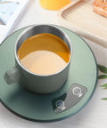 Electric Desk Cup Warmer And Cooler For Coffee Mugs Cans Bottles Precise Hot Cold Temp Control Keep Your Daily Brew Cozy Or Truly Ice Chill Home Office Game Changer Easy Wipe Surface with a mug on a touch screen base.