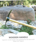 Wooden handle pickaxe on rocks in garden with ergonomic design for efficient weeding and soil digging in vegetable and flower gardens.