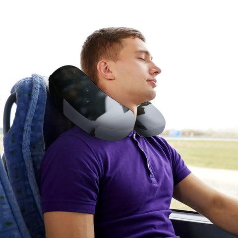 Man using Snow Owl Travel Pillow Comfy Ergonomic U Shaped Neck Support With Memory Foam For Planes Trains Cars And All Day Trips