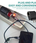 No Hassle Heavy Duty Automotive Power Converter Steps Down AC 220V To DC 12V Right Out Of Your Cigarette Lighter Port, shown plugged in.
