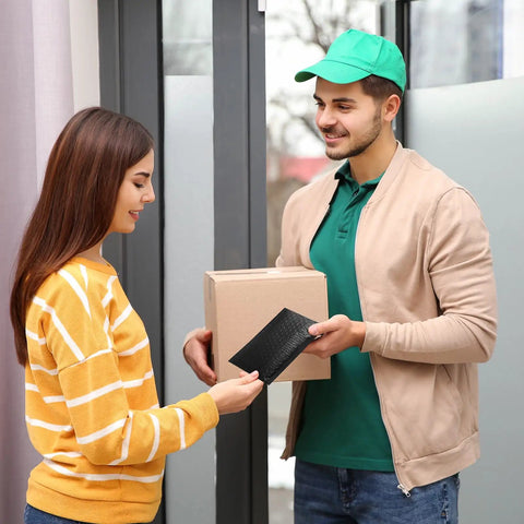 Person receiving a Black Bubble Mailers 4x8 Inch Self Seal Adhesive Padded Envelopes 200 Pack Waterproof With Inner 4x7 Inch Usable Size