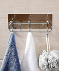Heavy Duty Wall Mounted Adhesive Free Suction Hooks With Rock Solid Air Pressure Grip hang blue and white towels and a bath sponge.