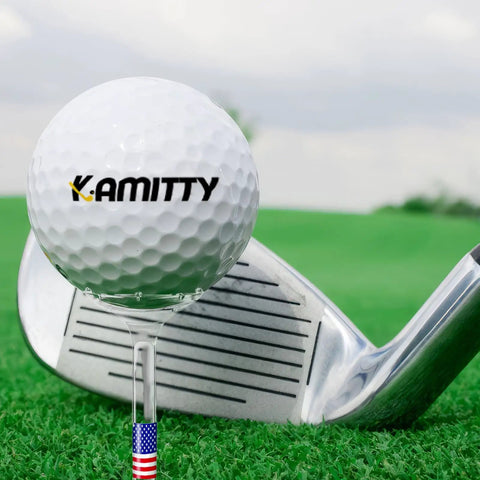 Golf ball on unbreakable plastic golf tee three and a quarter inch bulk pack of fifty or eighty USA flag design, on grass with club.