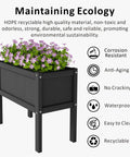 Raised Garden Bed With Drainage Hole Waterproof HDPE Elevated Planter Box With Legs Tough As Nails For Herbs Vegetables And Flowers Perfect For Patio Balcony Outdoors Or Indoors Black, showcasing flowers inside.